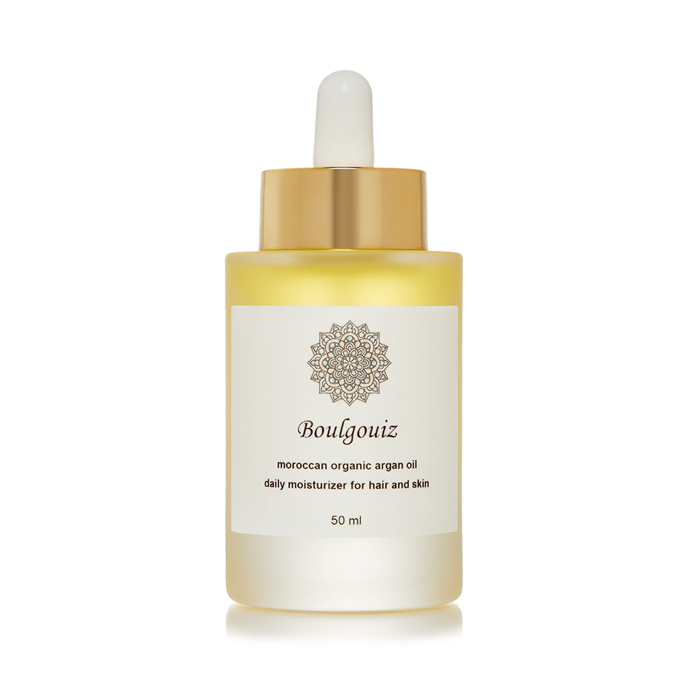 Golden bottle of Boulgouiz Moroccan Organic Argan Oil, a daily moisturizer for skin and hair, on a white background