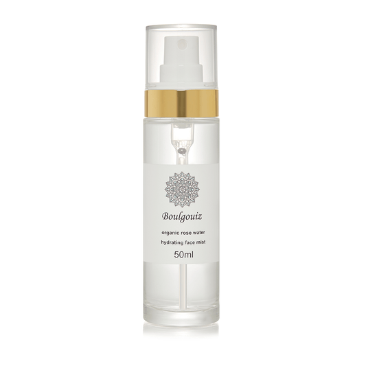 Clear bottle of Boulgouiz Organic Rosewater Face Mist on a white background